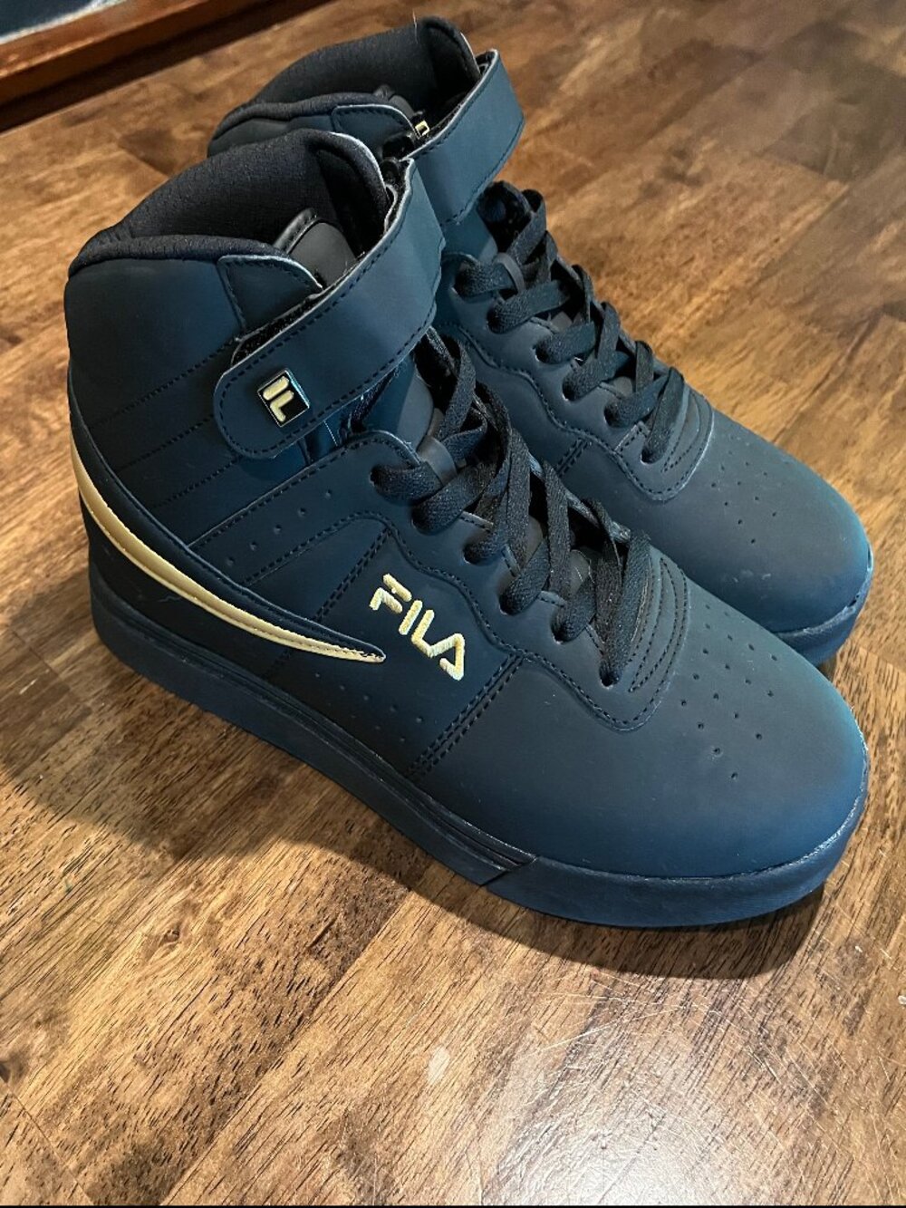 Fila black and Gold sneakers 11.5 Mens